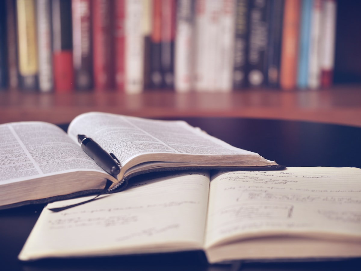 Open book with handwritten notes and a pen — SSC CHSL 2026 preparation